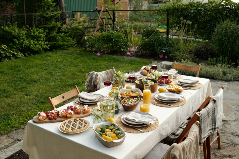 group chairs surrounding long table served with food drinks scaled