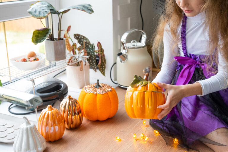 child decorates kitchen home halloween girl witch costume plays with decor holiday bats jack lantern pumpkins autumn comfort house scandistyle kitchen loft scaled