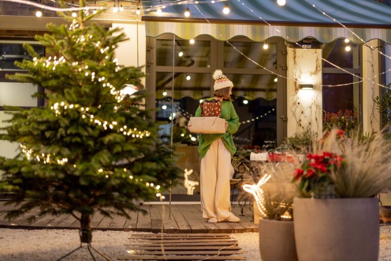 new years decorated backyard with woman walking with presents min scaled